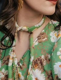 Woman wearing floral dress.